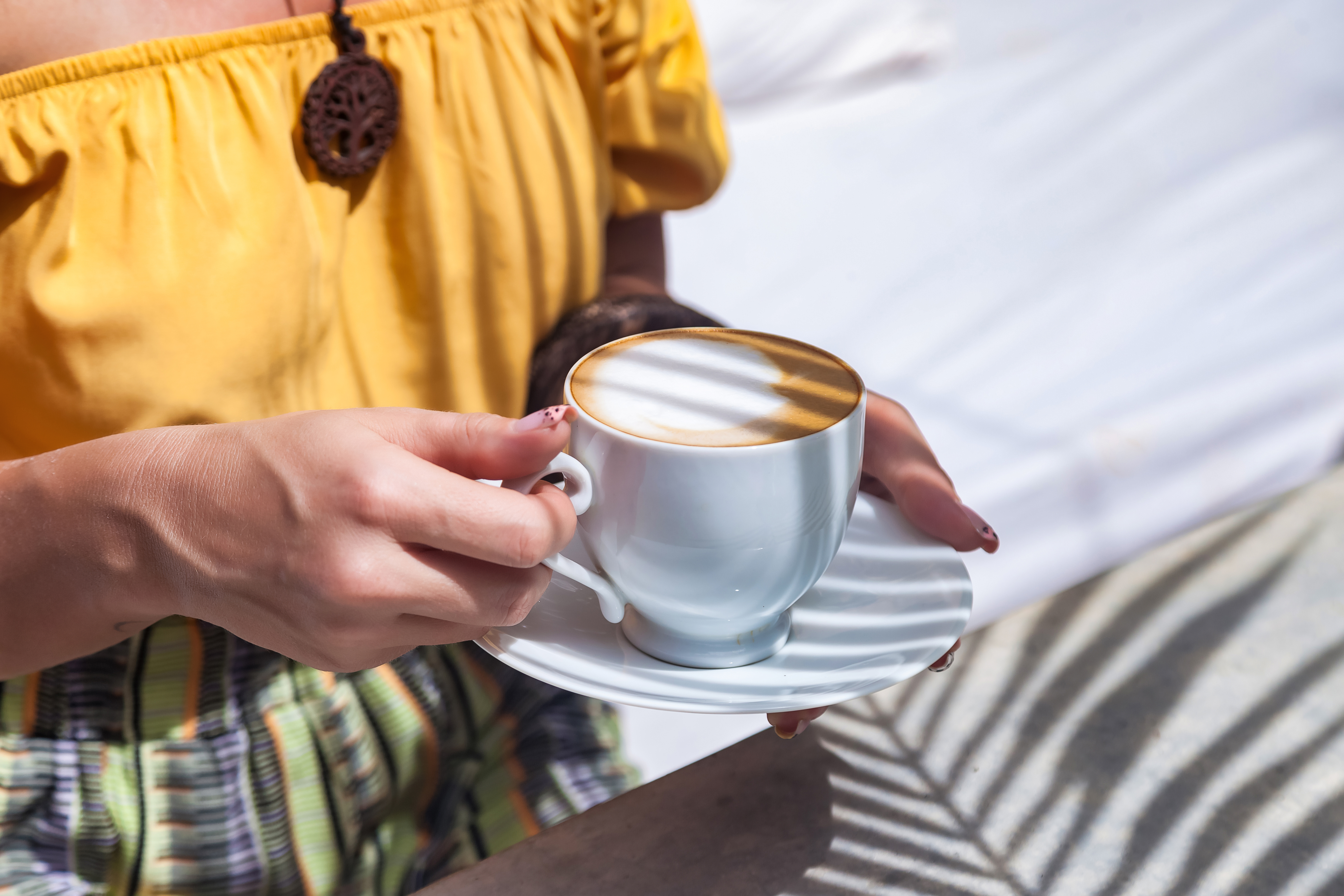 Close up hands caucasian young woman with coffee or tea cup